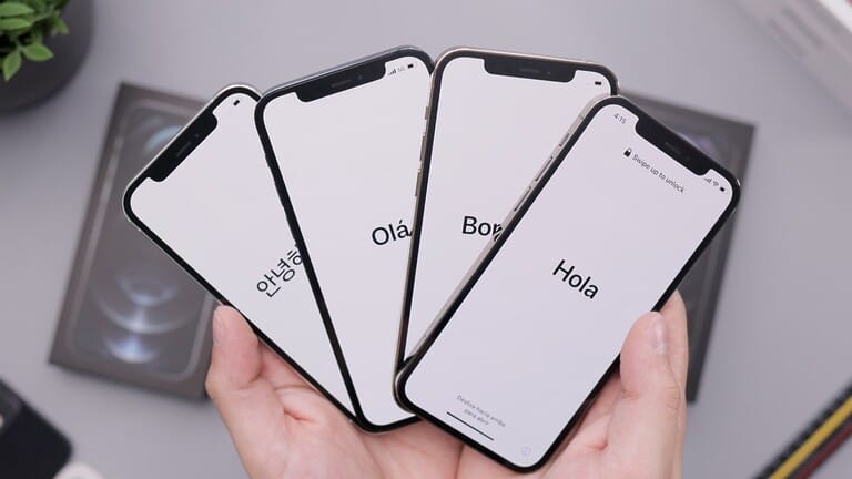 Four smartphones displaying "Hello" in different languages.